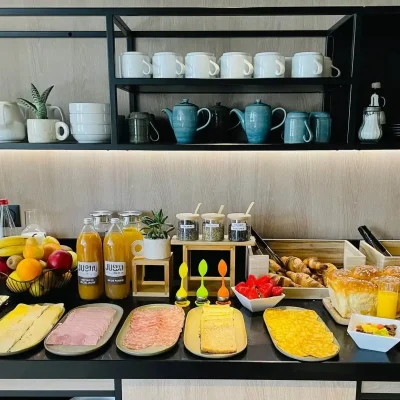 Full breakfast buffet with pastries, fresh juices, fruits and cheeses at Hôtel Villa Berlioz Lyon
