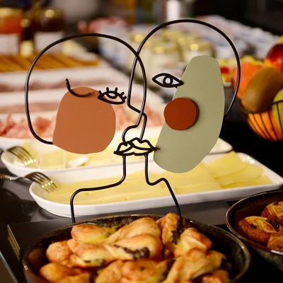 Breakfast buffet with fruits, pastries and cheeses at Hôtel Villa Berlioz Lyon