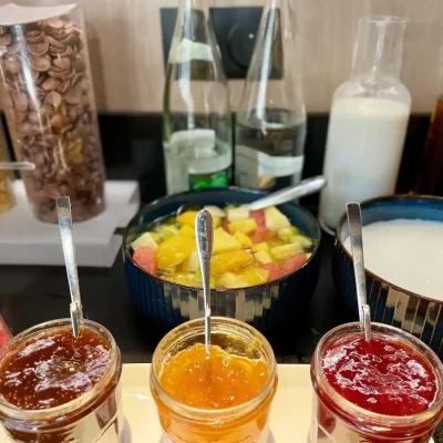 Cereals, fresh fruits and yogurts at the breakfast buffet at Hôtel Villa Berlioz Lyon