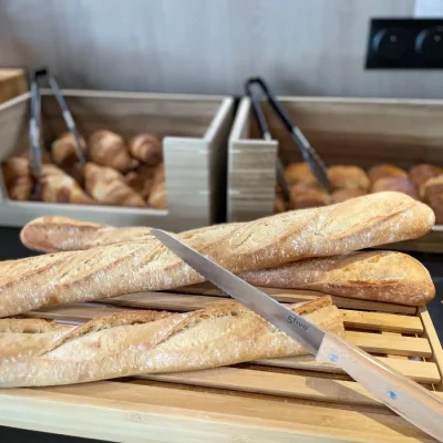 Fresh bread and pastries at the breakfast buffet at Hôtel Villa Berlioz Lyon