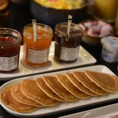 Pancakes served with artisan jams at the breakfast buffet at Hôtel Villa Berlioz Lyon