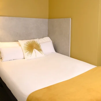 Comfortable bed in a Single Room at Hôtel Villa Berlioz Lyon.